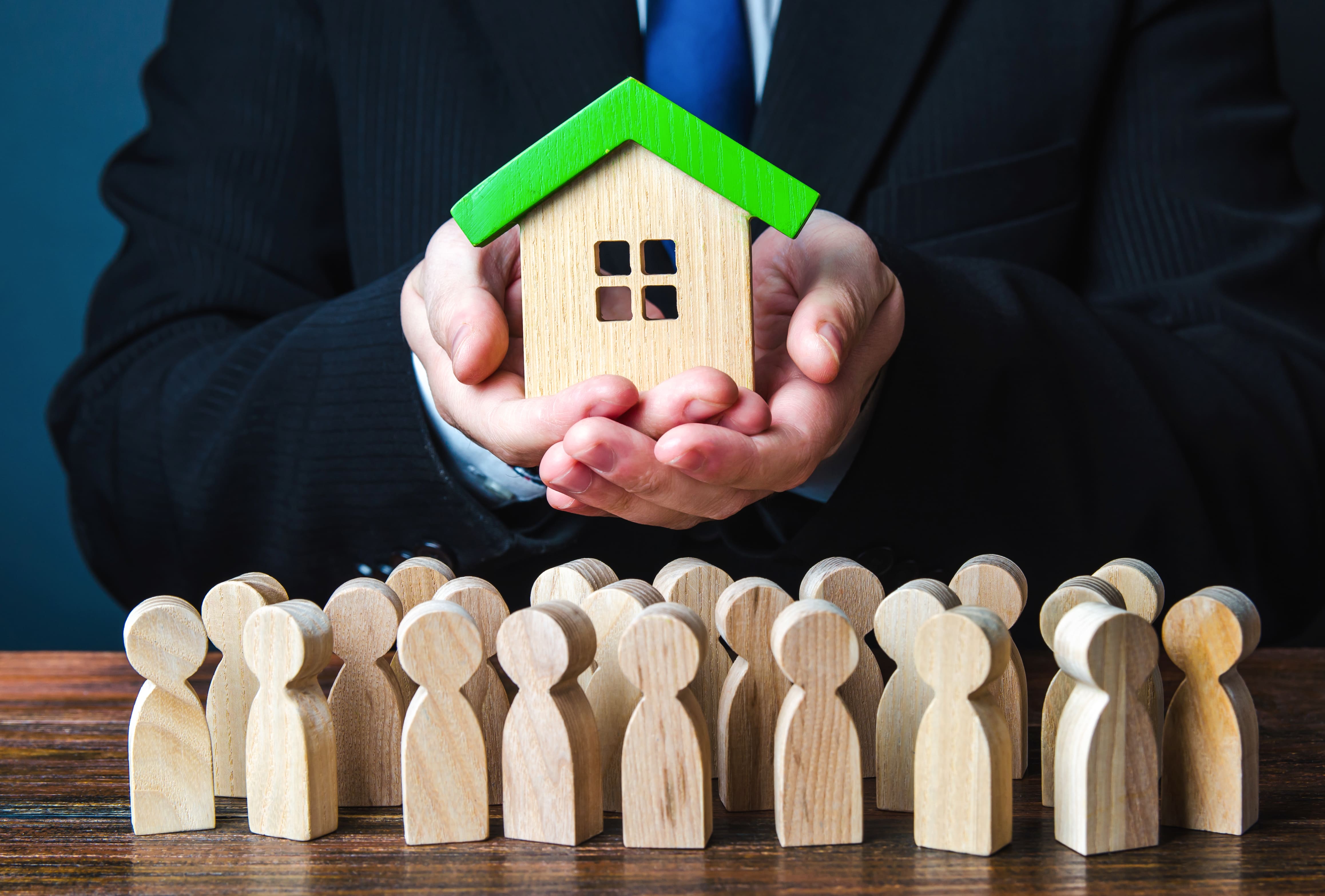 Bank agent approving a home mortgage loan application with a client