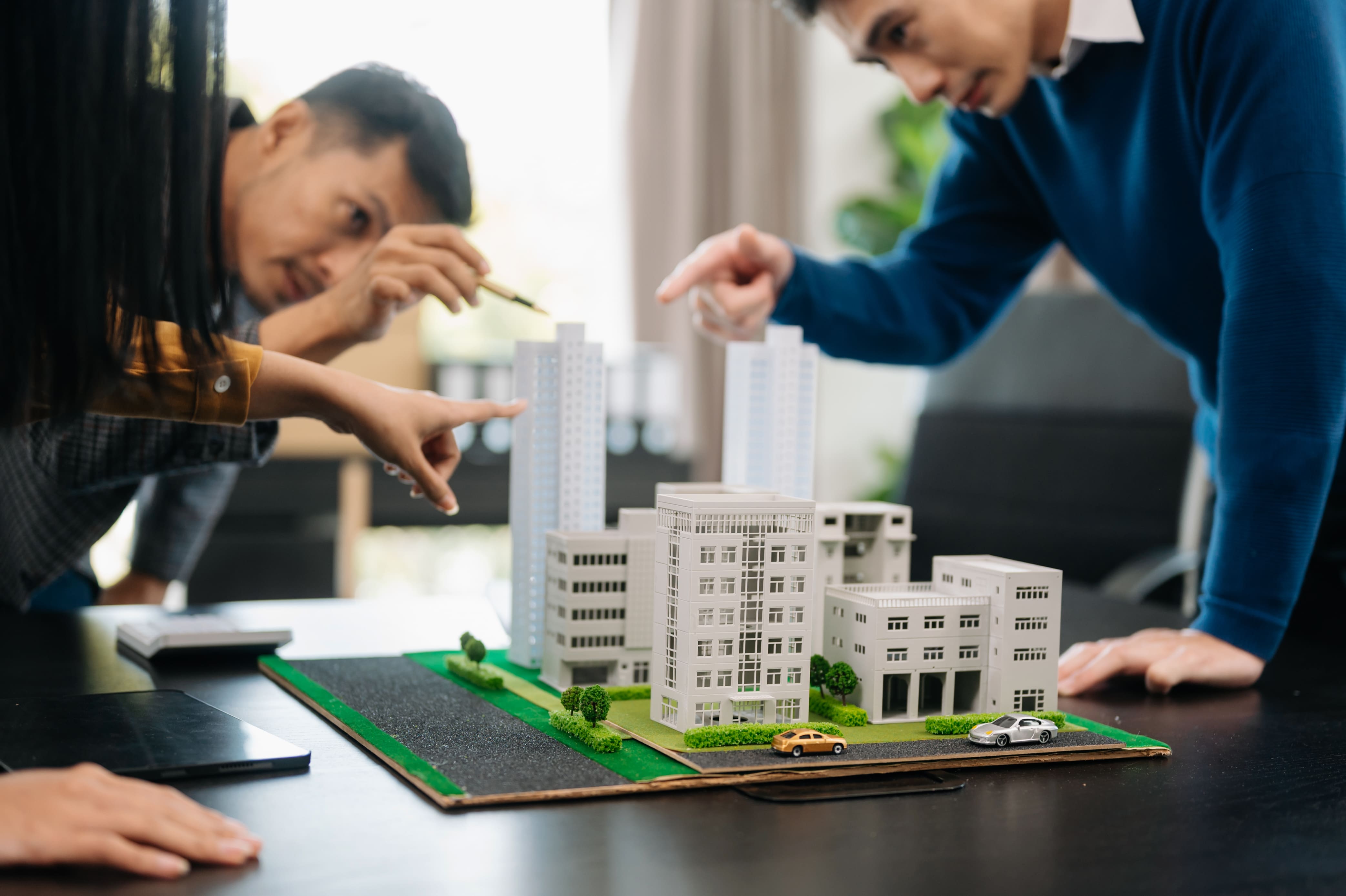 Customers choosing between apartment options with a real estate professional