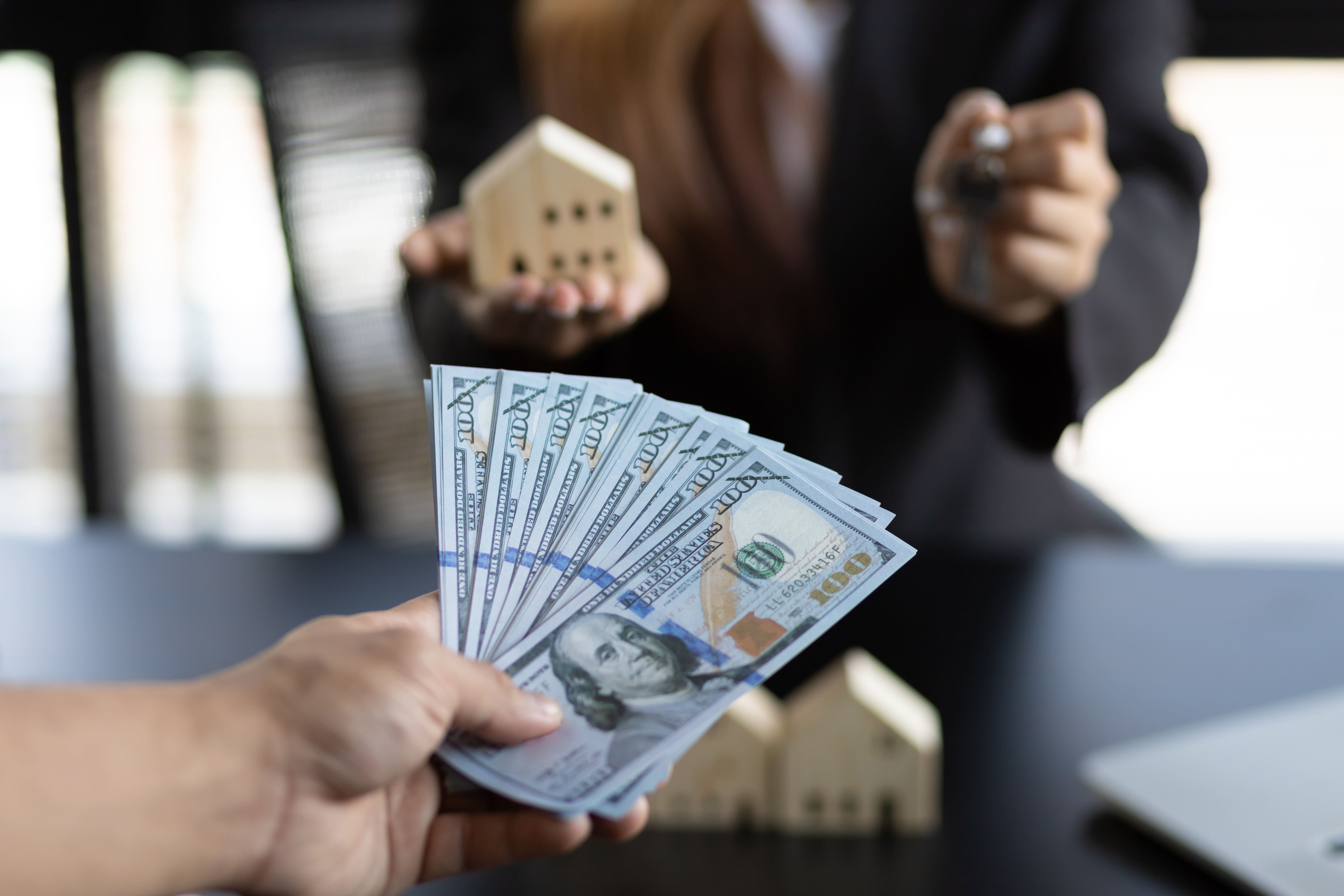 Cash exchanged for property keys representing a real estate transaction