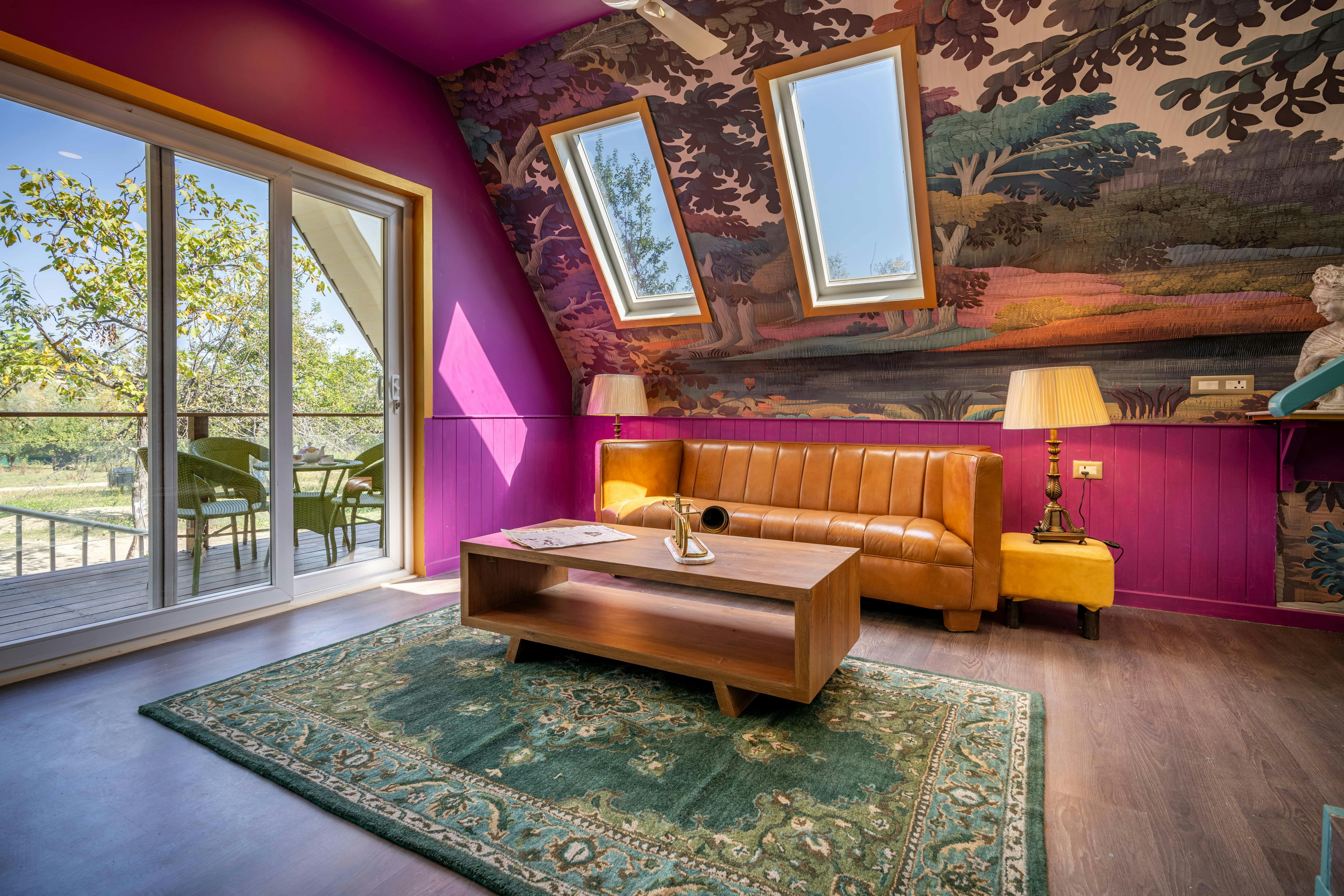 Colorful STR attic room with painted forest mural and skylight windows
