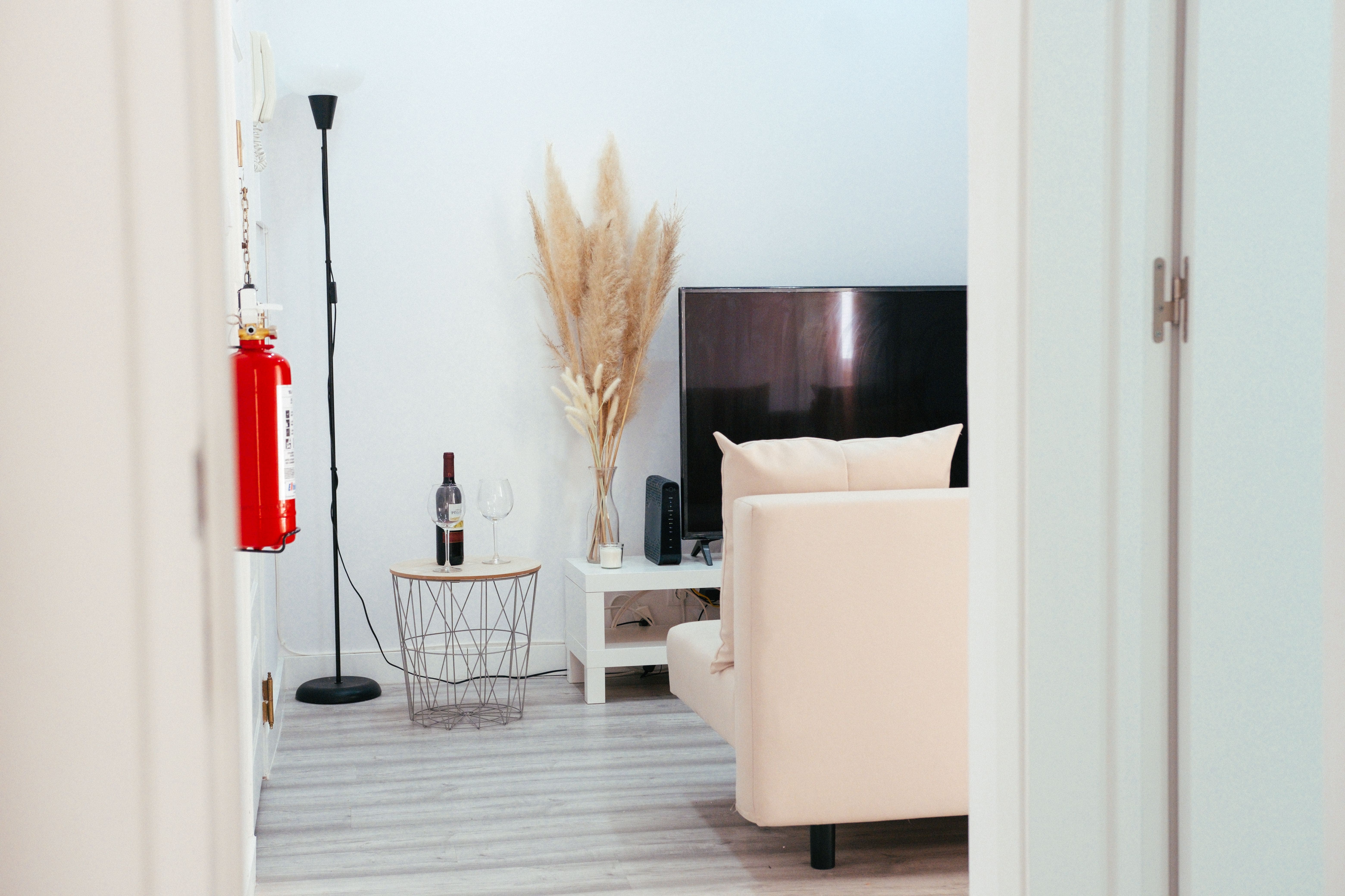 Cozy STR living room with cream sofa and flat screen TV