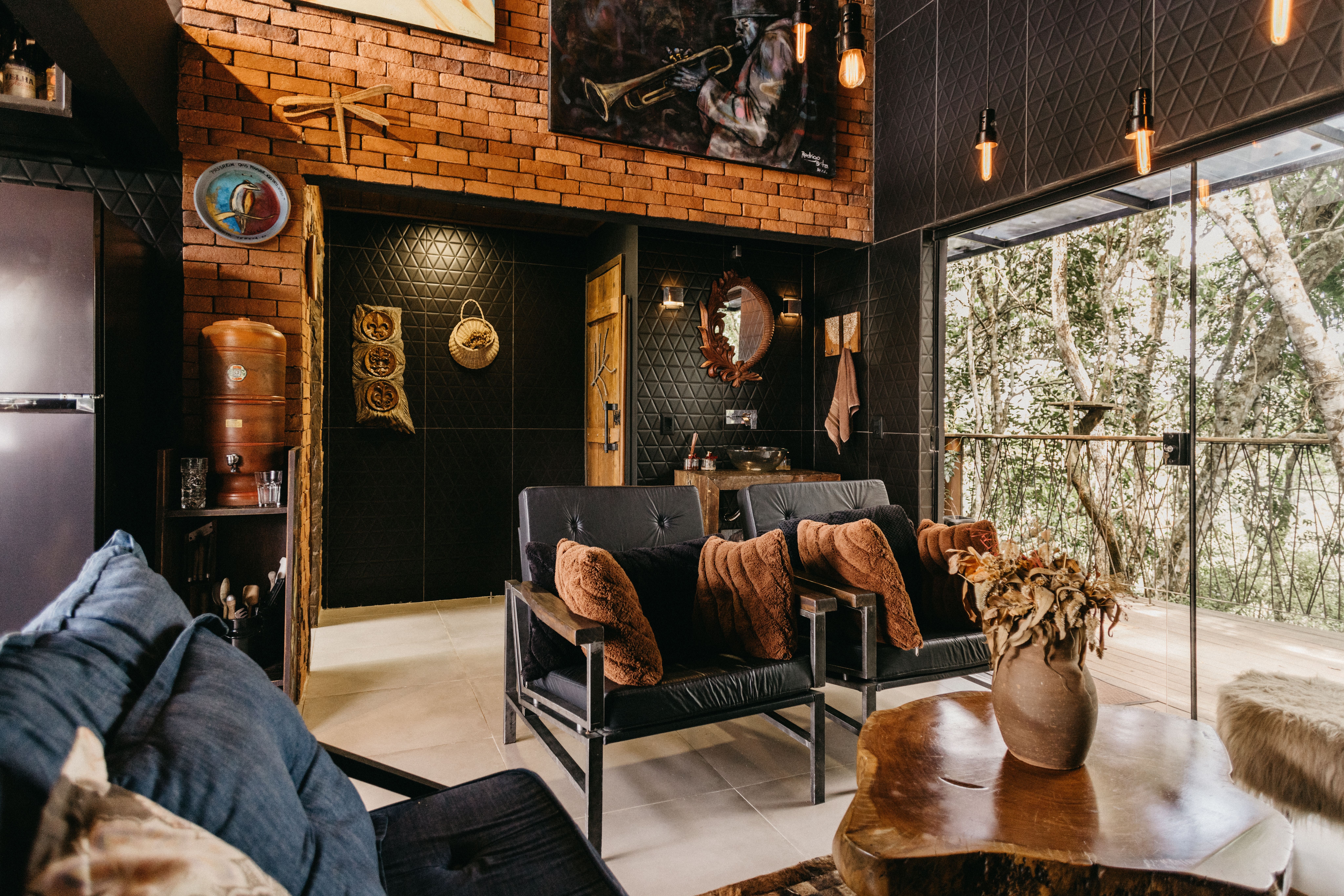 Moody STR cabin living room with brick wall and Edison bulb lighting