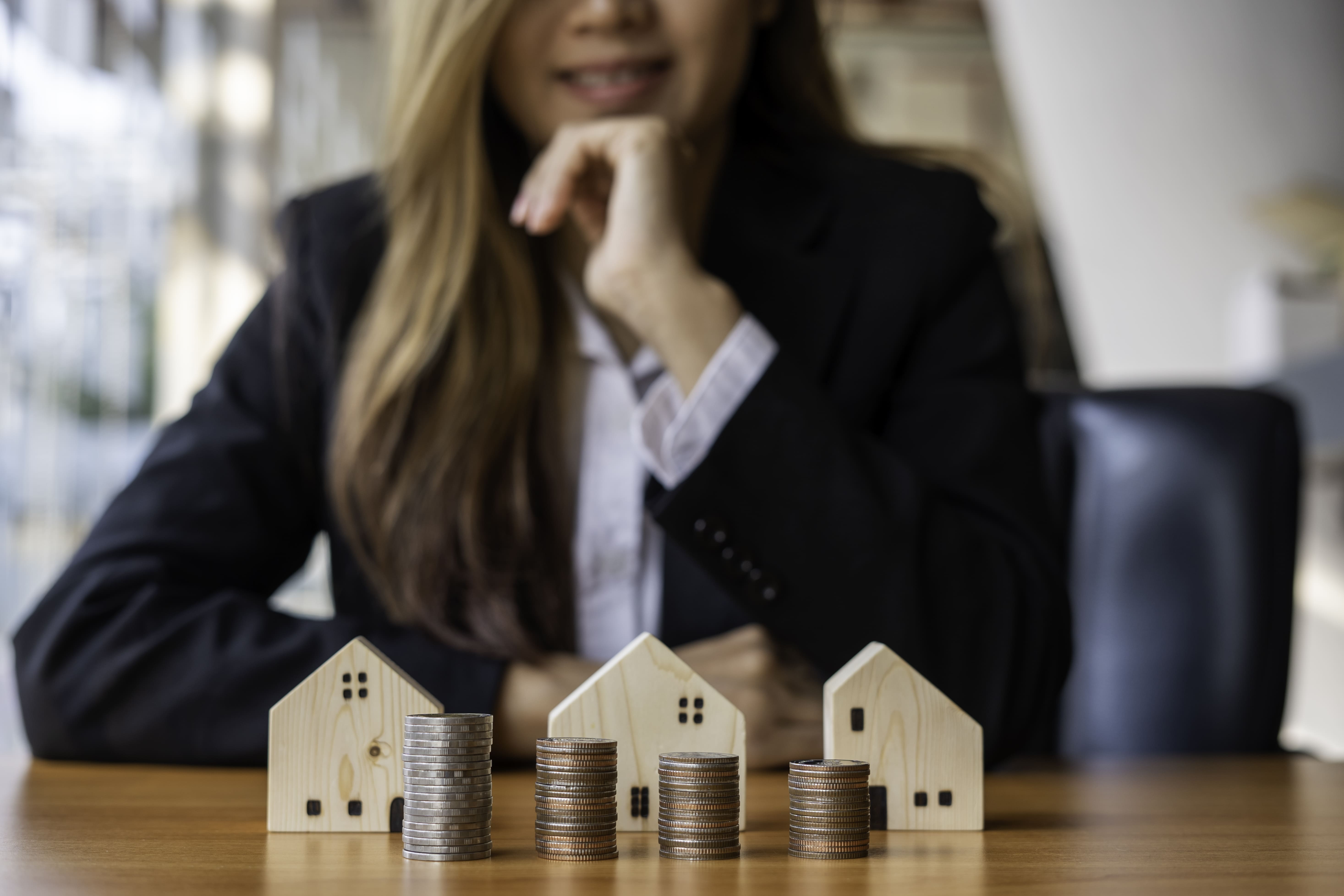Female investor evaluating and reviewing her property portfolio